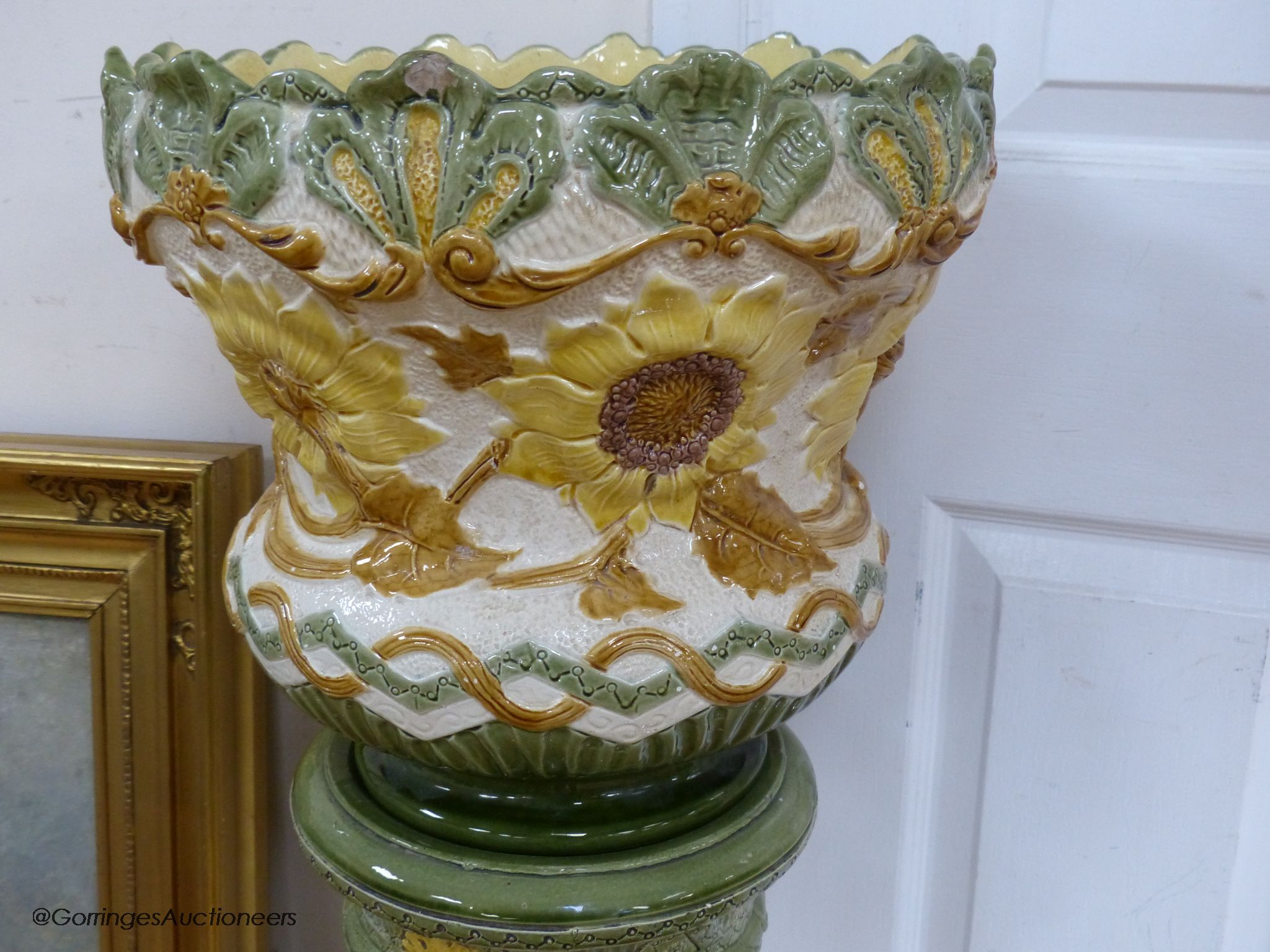 A Burmantofts faience jardiniere on pedestal, 105cm high